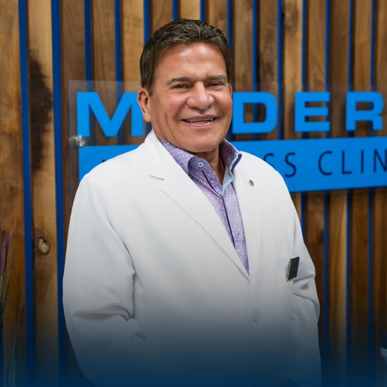 Robert J. Webb, PA, in a white coat.
